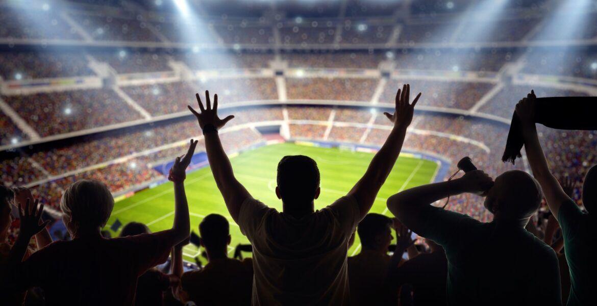 soccer-fans-at-stadium.jpg_s1024x1024wisk20chErbMMbCwhWHL-ww9hP6BRDnF29njEPdHJLqhSKxbn8-1170x600.jpg